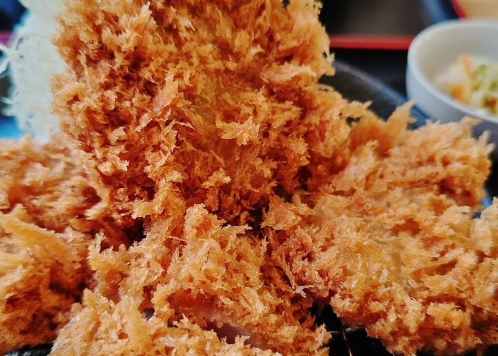 A close-up shot of tonkatsu deep-fried pork at Tonkatsuya Sato, a Michelin star tonkatsu restaurant in Tokyo.